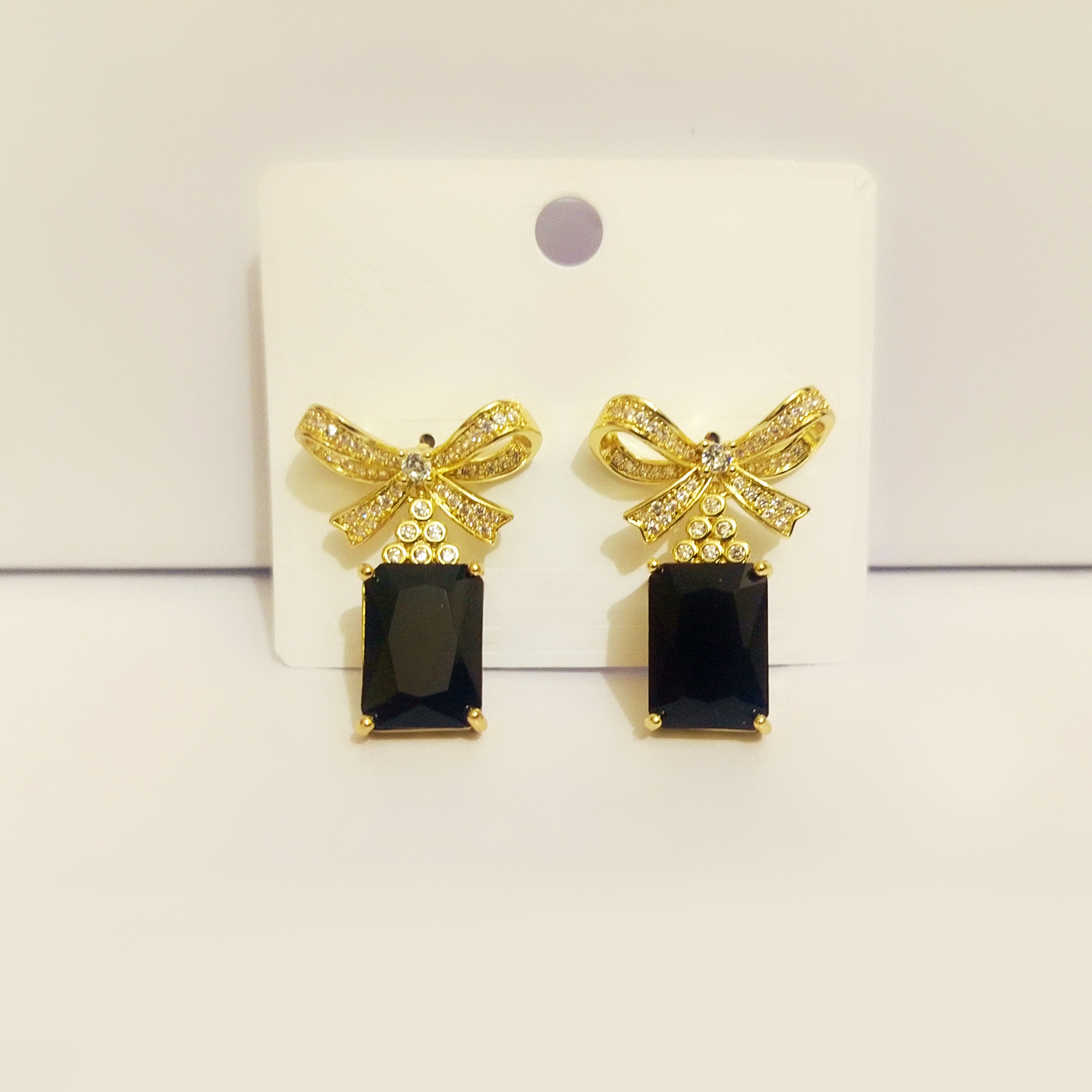 Sparkling Rhinestone Bow Earrings with Black Emerald-Cut Gemstone